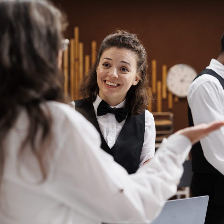 Concierge assists with check-in at hotel